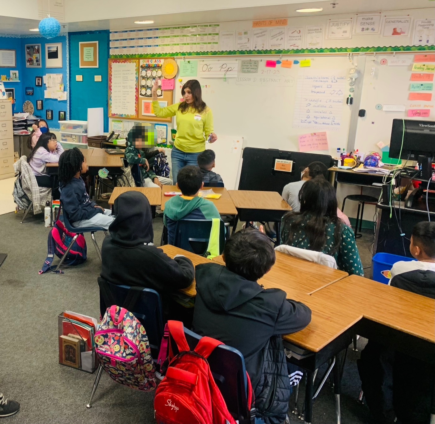 Shruti Kumar speaking with students in a classroom